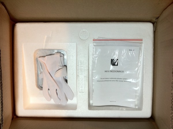 Inner box opened. Note white gloves.